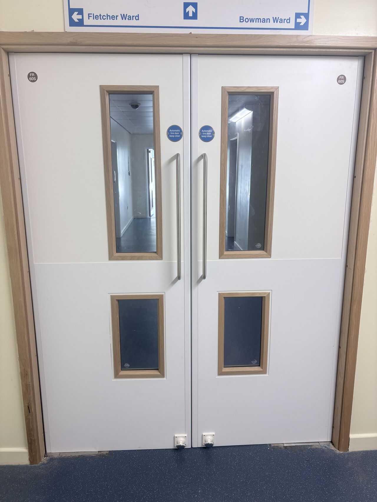 New double fire doorset with vision panels installed on a hospital ward corridor, Bodmin Hospital