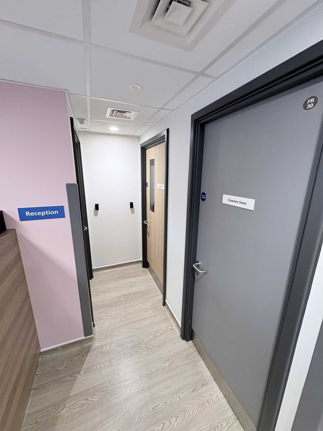 Reception corridor with replacement doorsets in a live healthcare unit