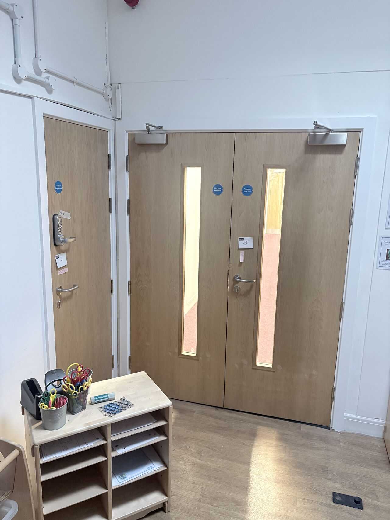 New double doorset installed beside classroom furniture in a school, Weston-super-Mare